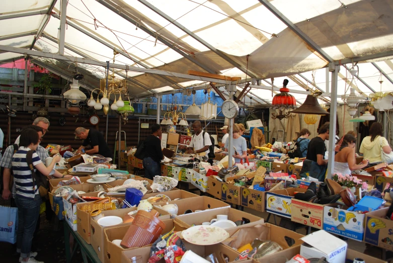 an outdoor food market with lots of people