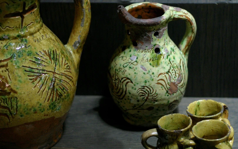 a number of vases on display on a counter