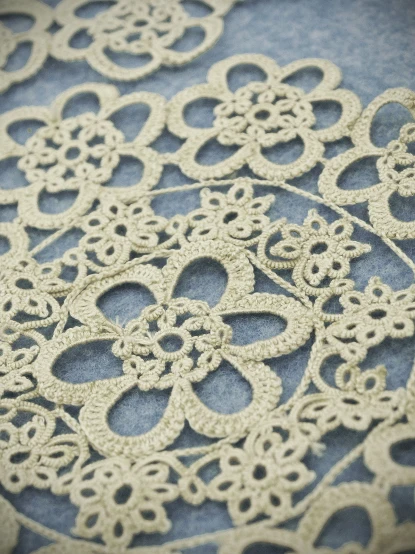 a close up of some fancy white lace