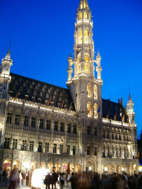 a castle - like building with spires at night