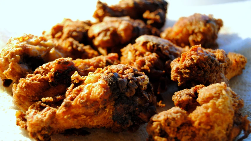 a table topped with fried food on top of it