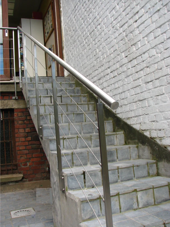 the railing is leaning sideways on the floor of an outdoor area