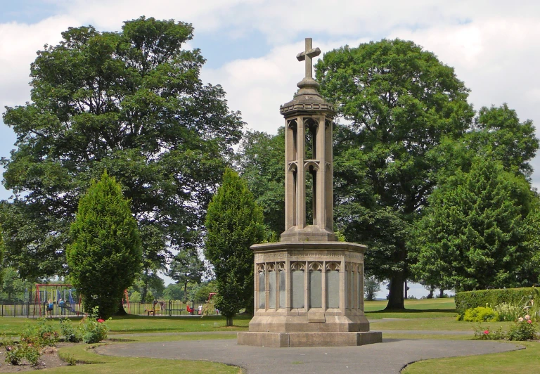 a monument sits in the middle of a park