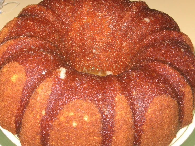 a cake sitting on top of a cake plate covered in icing