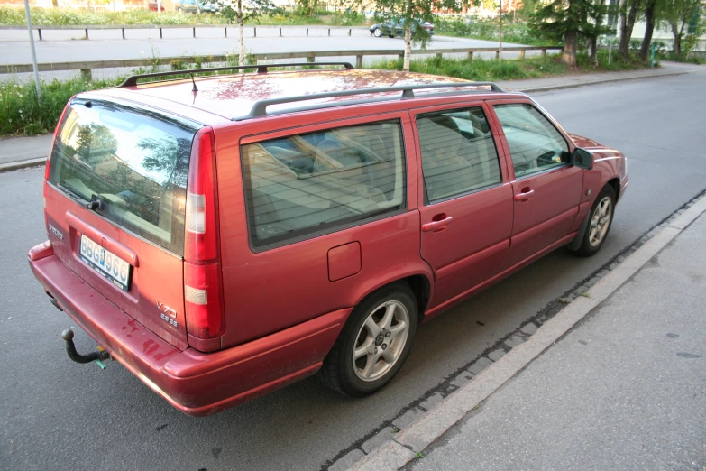 the car is parked on the side of the road