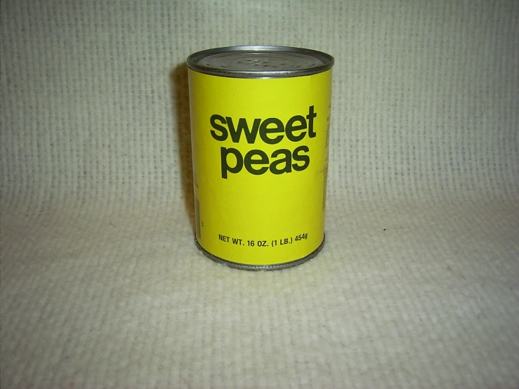 a yellow tin that is sitting on a table