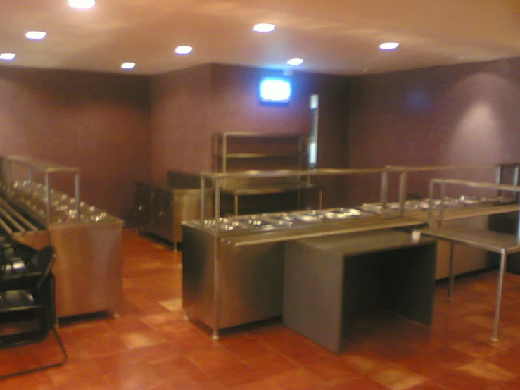 the inside of a restaurant with benches and wine glasses on the tables