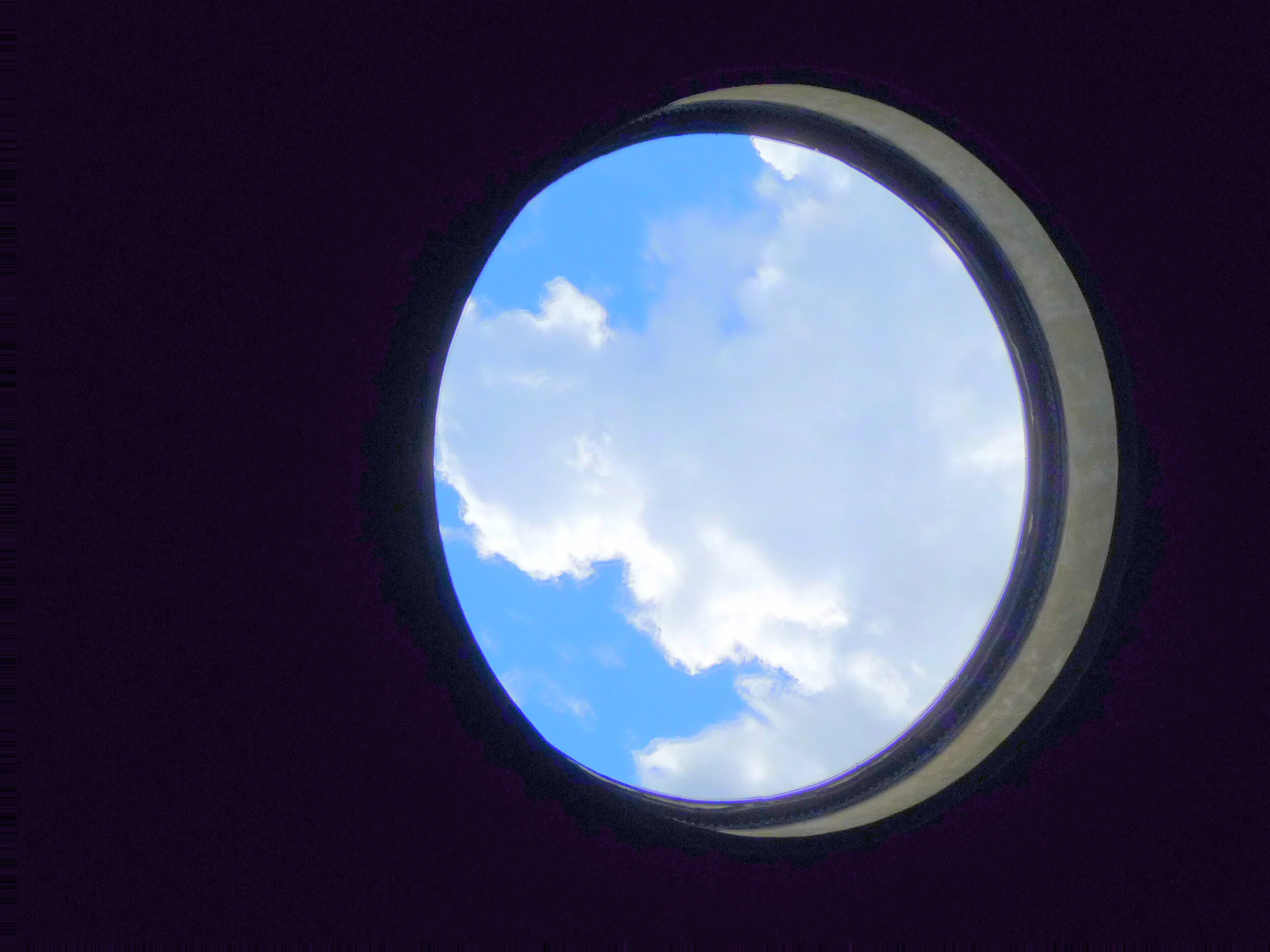 an image of a window showing the sky through it