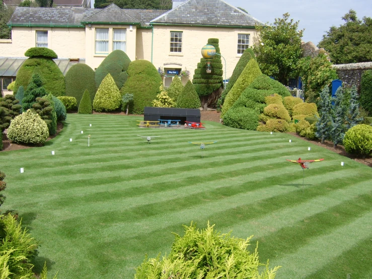 an outdoor area with various types of bushes and trees