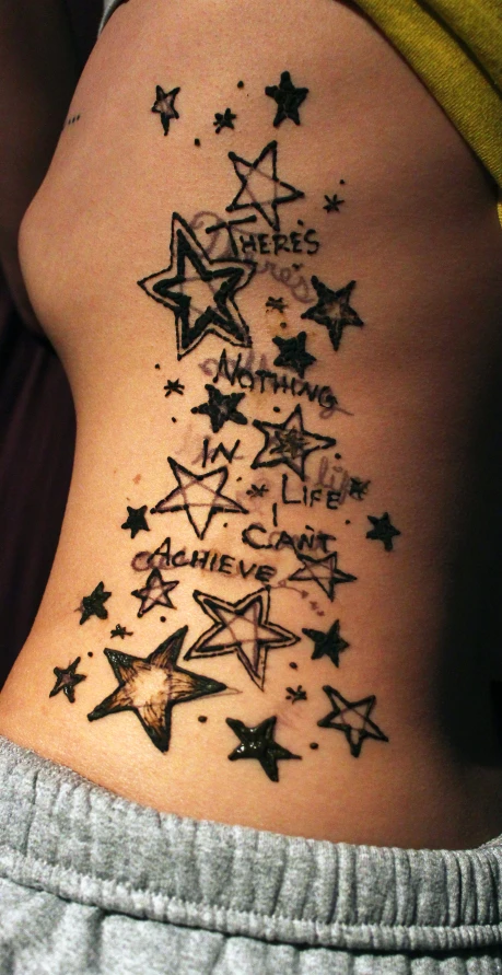 an image of a tattoo with stars on it