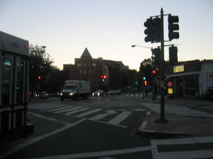 there are cars that are going down this street