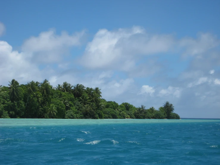 a lone island off the coast of a tropical isle