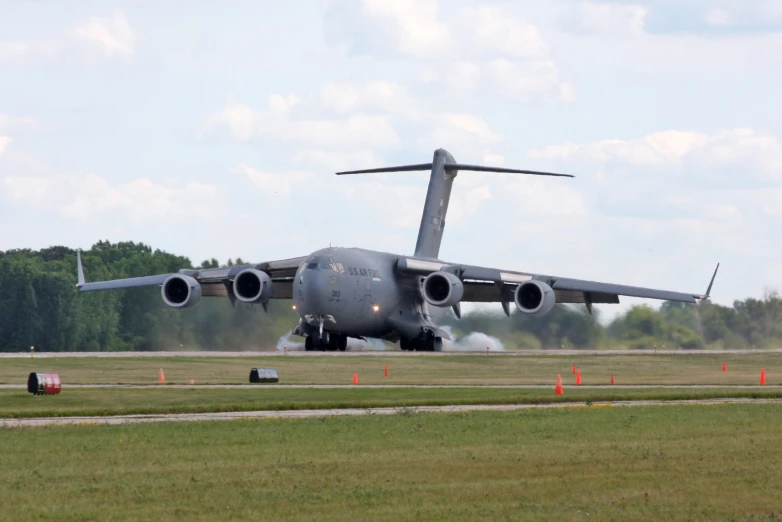 an airplane on the runway with its propellers down