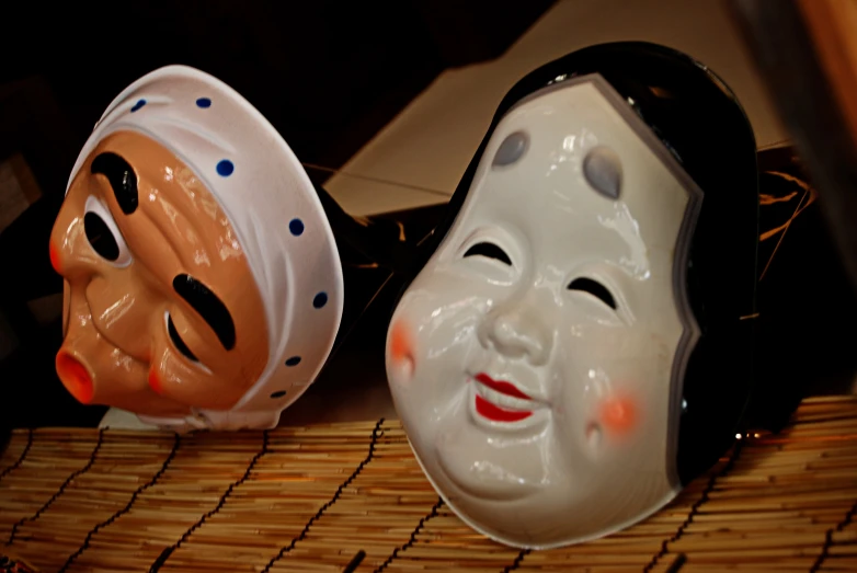 two theatrical masks of one and the other are upside down