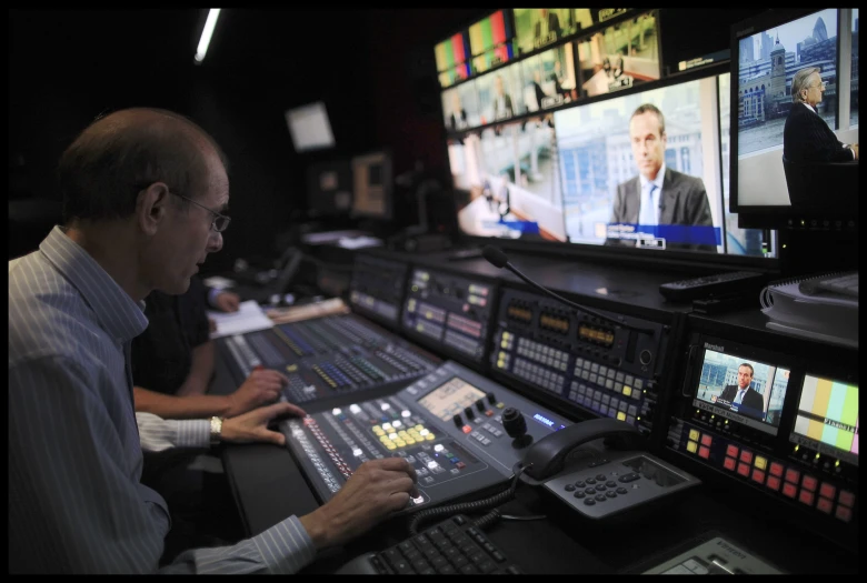 a man working at a mixing table