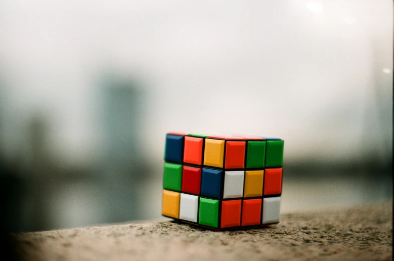 a cube sitting on top of a concrete floor