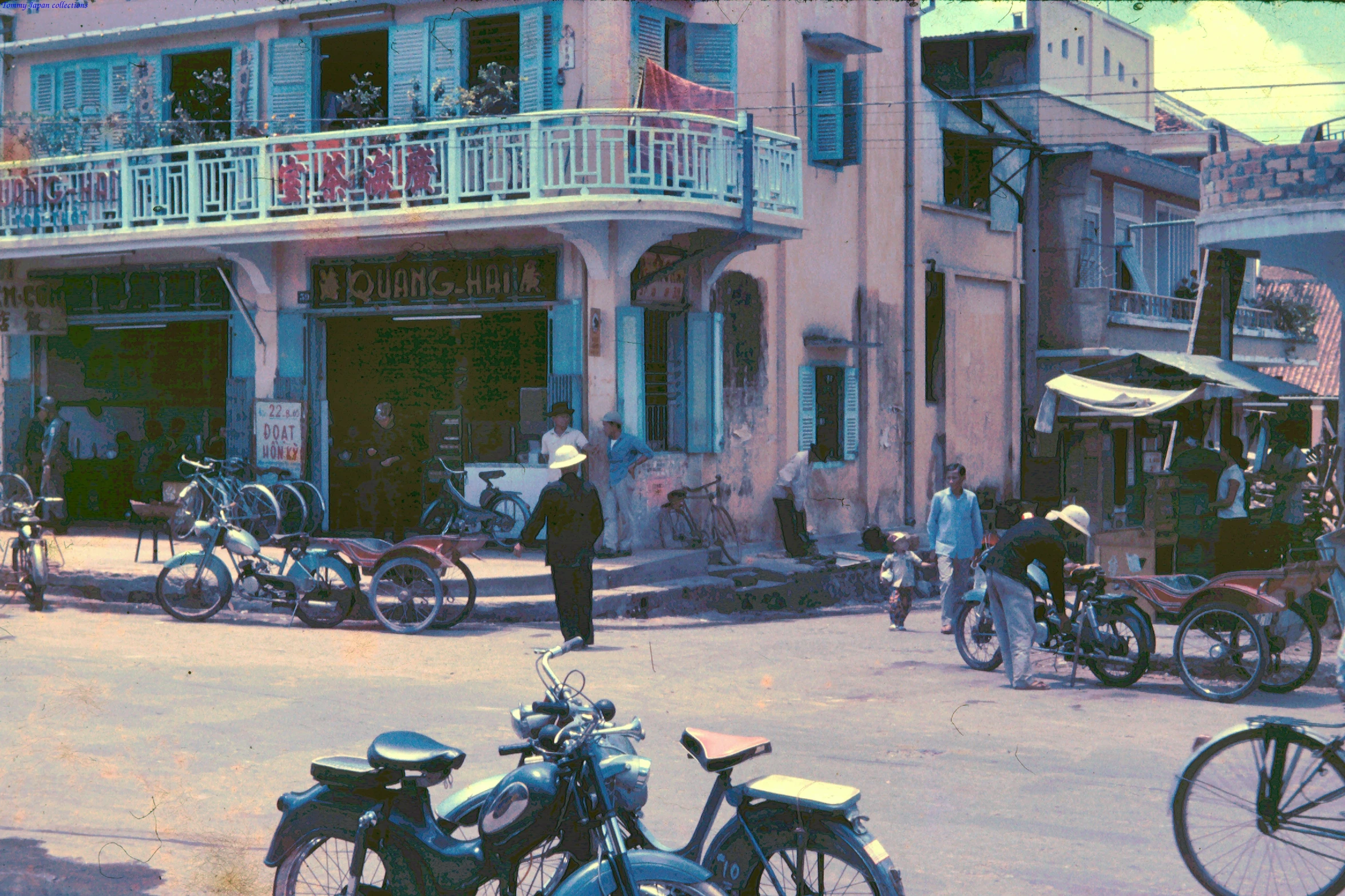 a group of people walking around a city street