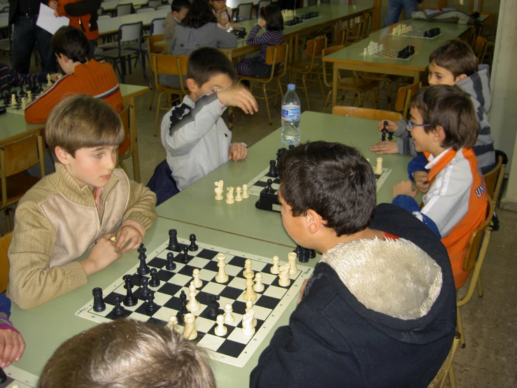 a number of children playing chess