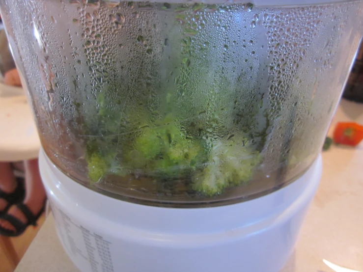 some food in the side of a blender,