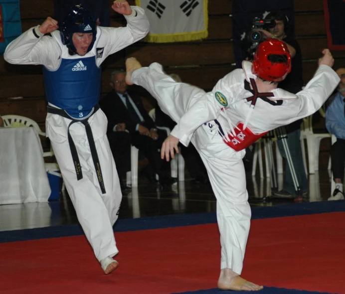 two boys are competing in karate martial competition