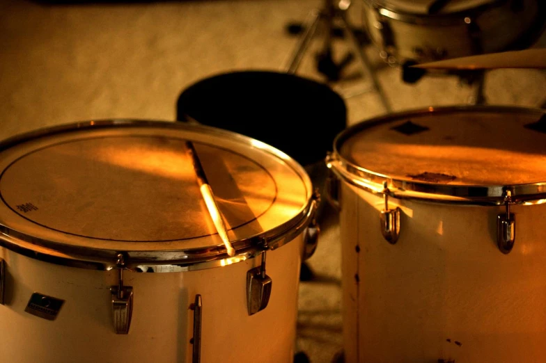 a pair of white drums sitting on a table