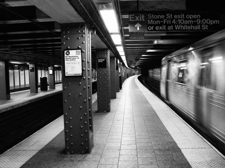 a subway with its lights on as the train approaches