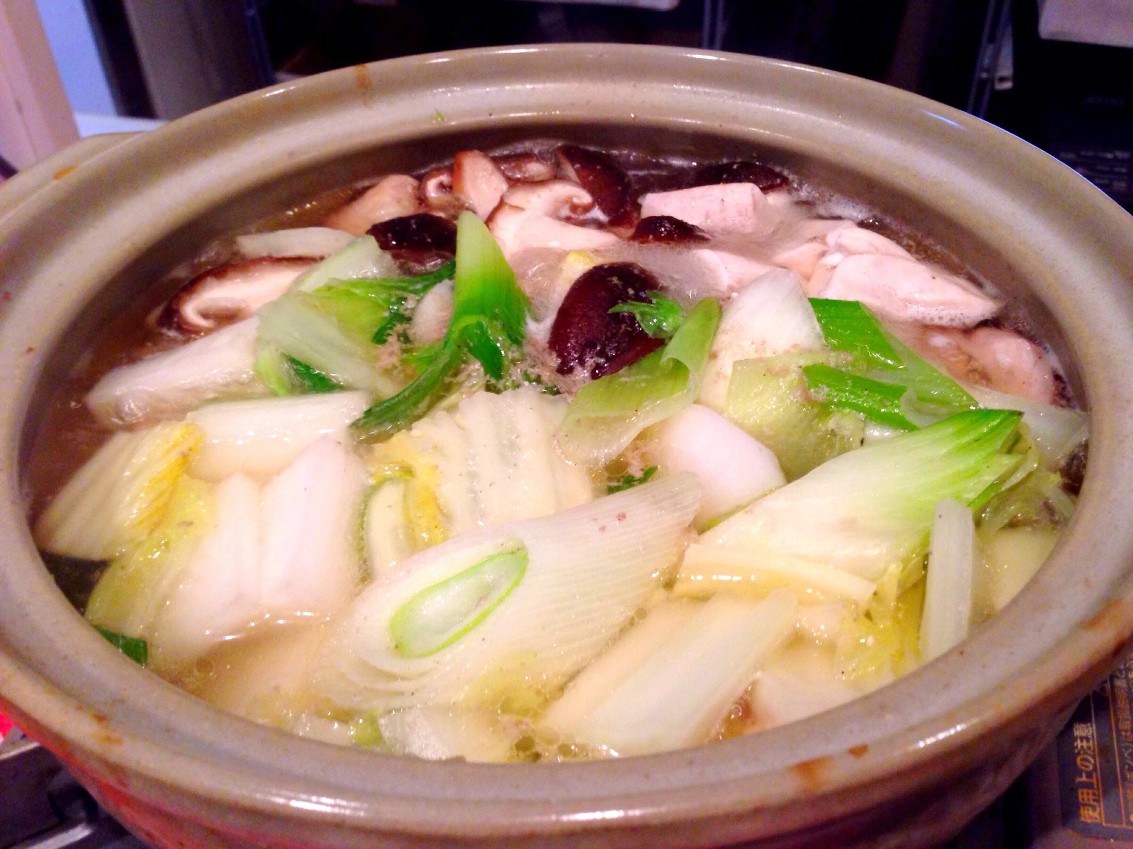 some type of food sitting inside of a brown bowl