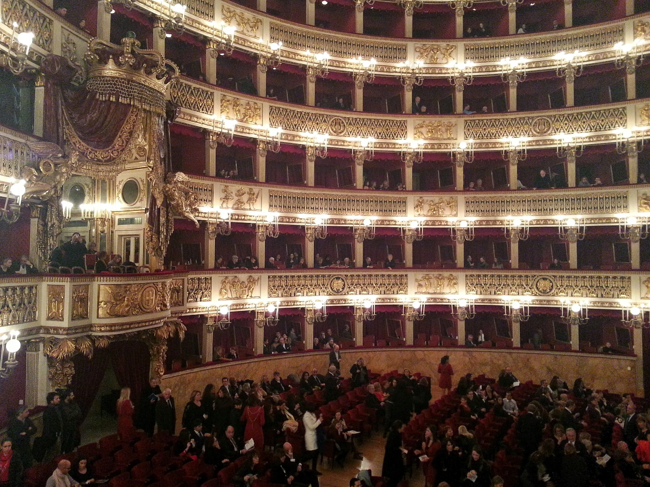 the auditorium of a opera has an ornate ceiling