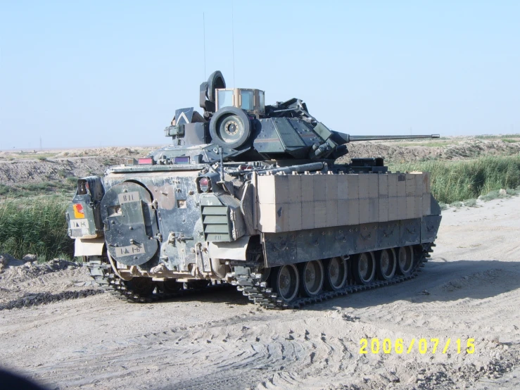 an army transport vehicle parked in the dirt