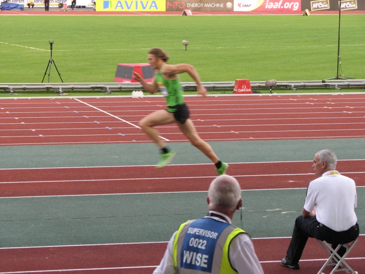 a woman running a long distance race during the day