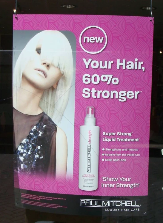 a close up of a sign advertising hair