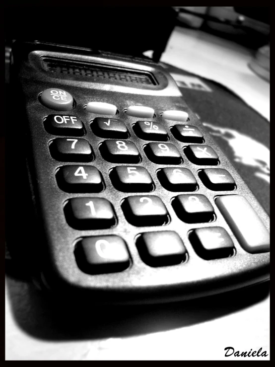 a calculator is shown sitting on top of a desk