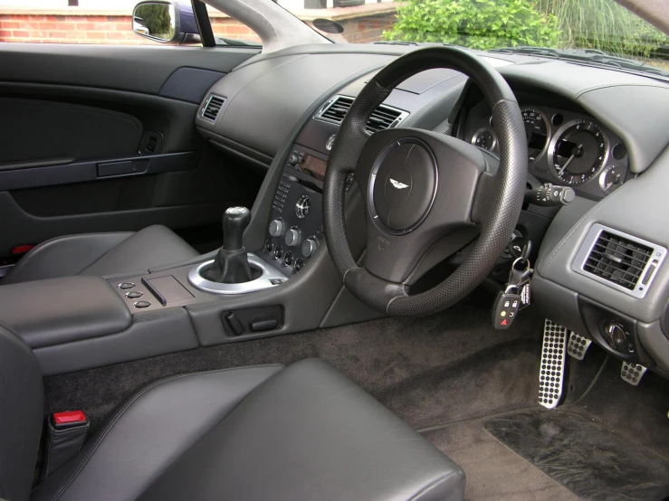 a clean, well equipped car interior with dark wood trim