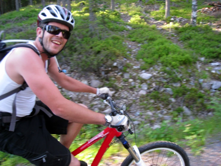 a man is riding on a mountain bike