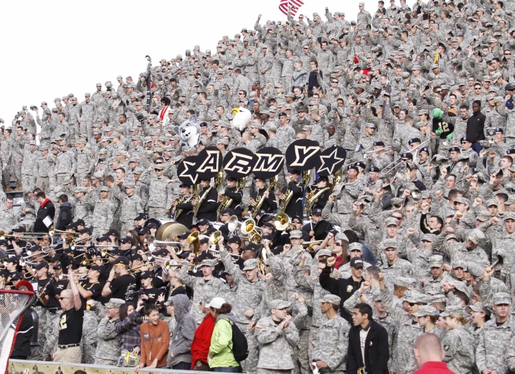 a large group of people are watching a military parade