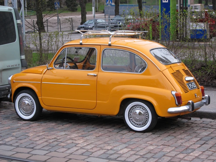 an orange citgo taxi parked on the side of the road