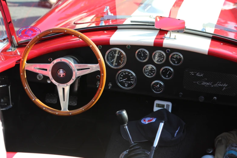 a car dashboard with wooden dash lights and a black top