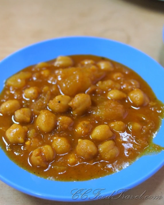 a blue plate with some kind of food in it