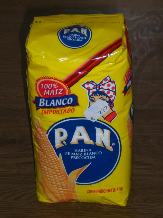 yellow bag on table near wood surface, containing flour