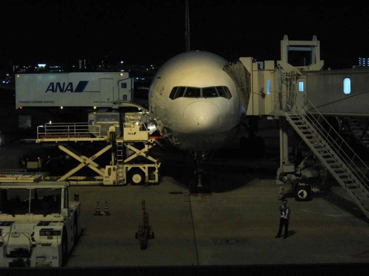 an airplane being serviced at the airport