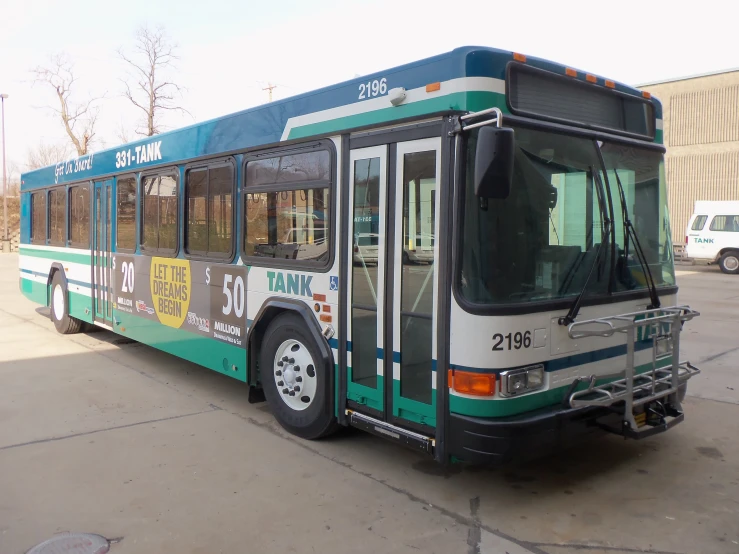 a bus is shown in a parking lot near other vehicles