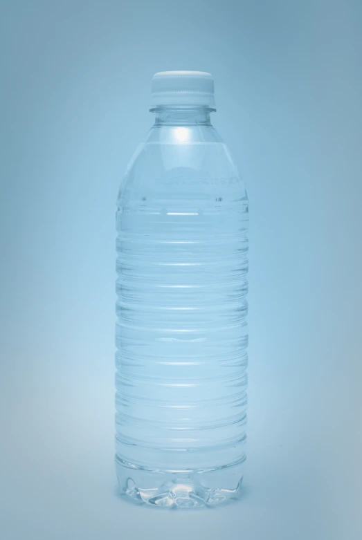 a bottle of water on a gray background