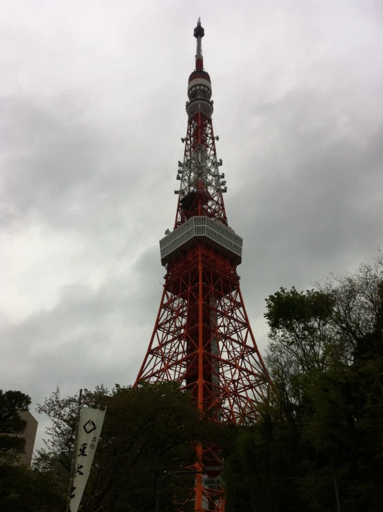 a tall red tower sits in the distance