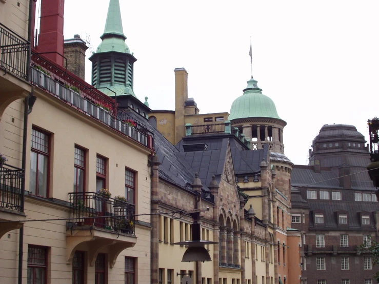 a group of buildings with some green roofs