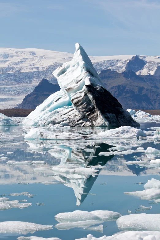 there is a rock on the surface of the water