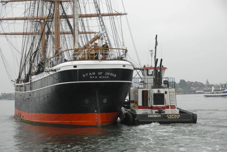 a large boat that has stopped at a dock