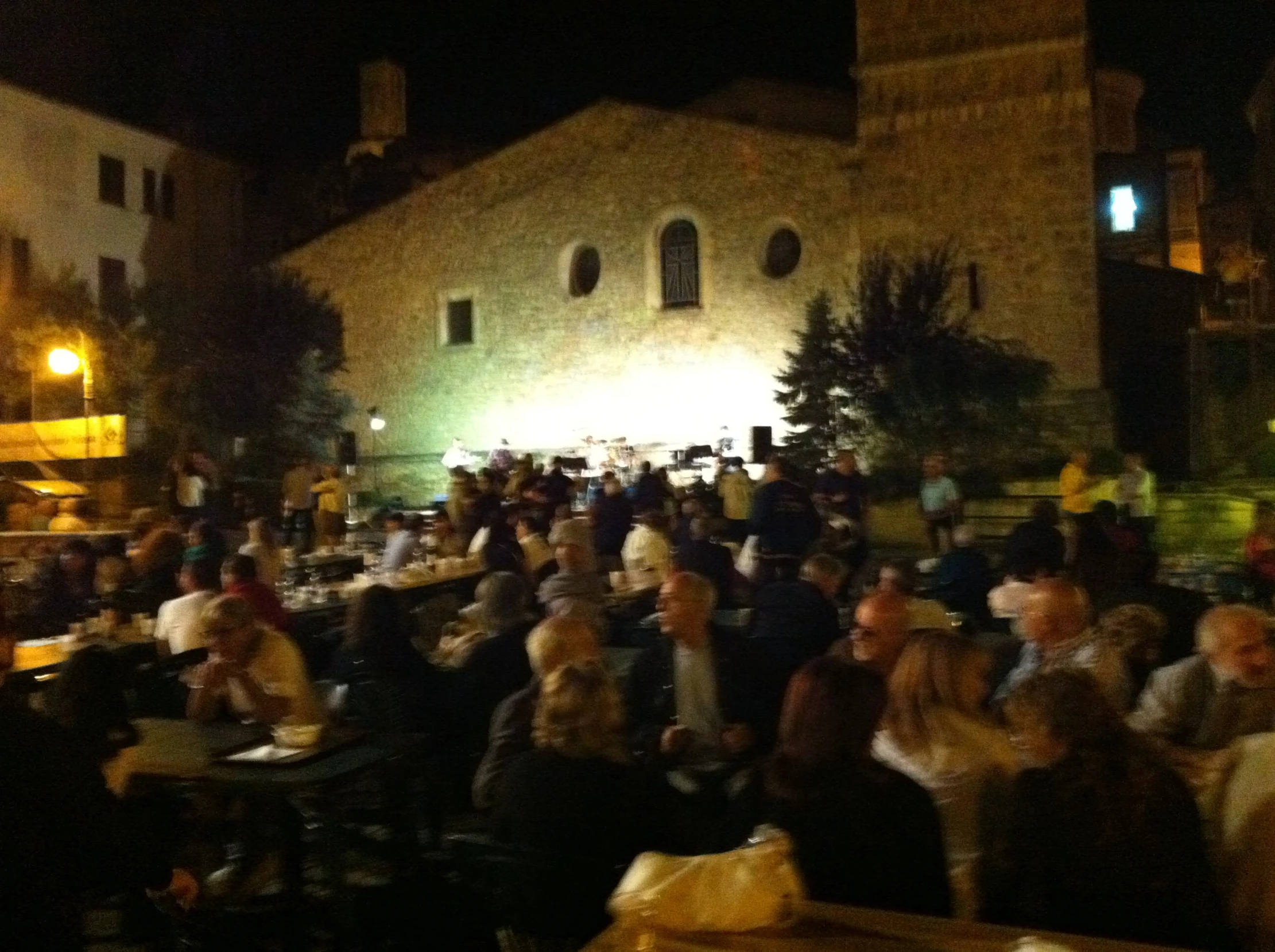 a big crowd is gathered to drink and dine