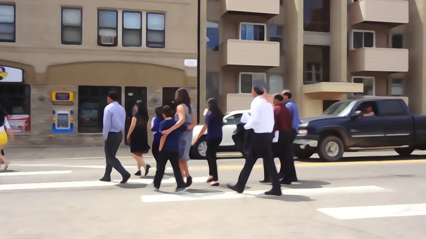 people walking across a street in front of some buildings