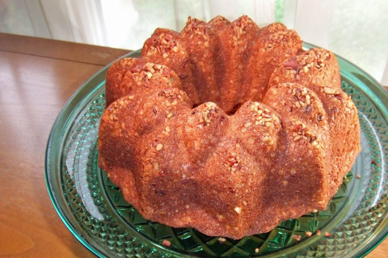 a bundt cake on a glass serving platter