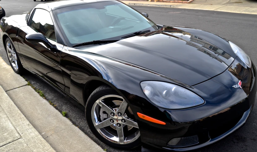 the black sports car has large wheels